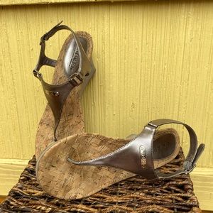 Silver/gray wedge sandals.
